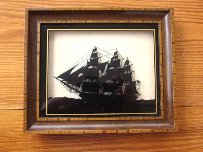 A fine reverse painting on glass (silhouette) of OLD IRONSIDES made by C & A Richards of Boston circa 1925